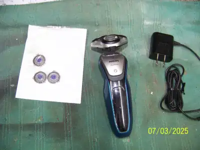 Philips Aquatouch Electric Shaver, comes with charger and extra set of blades. Asking $45.00. Phone...