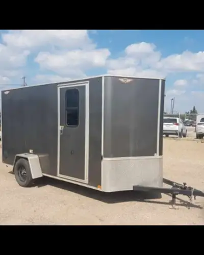 Cargo trailer, ready for all your hauling needs! It features a side door for easy access. Specificat...