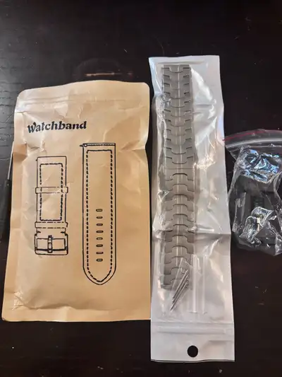 Elevate your timepiece with this robust metal watch strap, complete with a handy length adjustment t...
