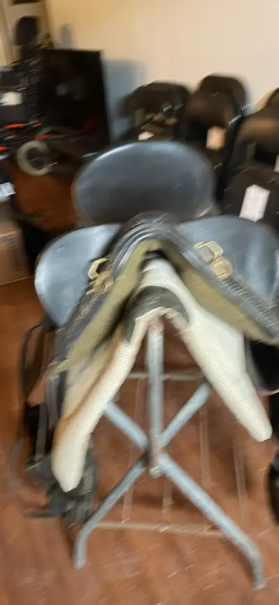 Stock saddle including saddle pad and halter tye bridle with loose ring snaffle bit. Cornwall area c...