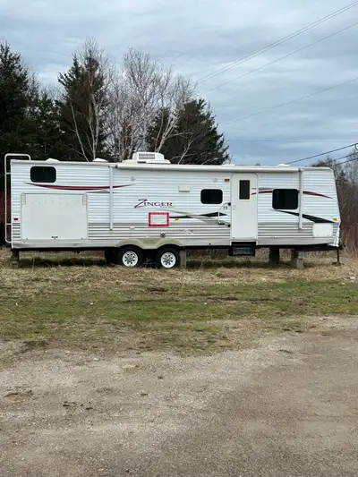 As is where is 32’ travel trailer for sale with slide. Handy man fixer upper trailer that hasn’t bee...
