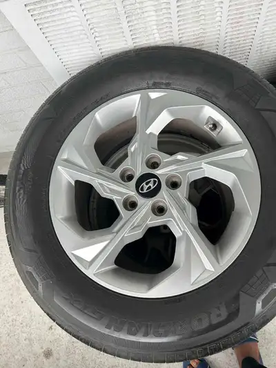 Selling a set of Hyundai Tucson all-season tires and rims, size 235/65R17, perfect for your vehicle....