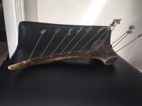 Vintage antler cocktail forks holder with 12 silver forks.