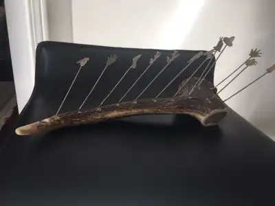 Vintage antler cocktail forks holder with 12 silver forks., View more