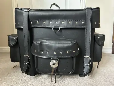 This Milwaukee PU leather touring bag is perfect for motorcycle trips, offering ample storage and a...