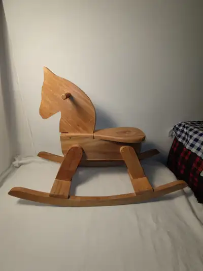 Vintage wooden rocking horse, made in Canada, Manitoba. it is in good condition except for some stai...