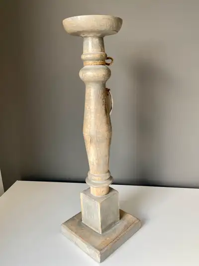 Sturdy wooden candle stand with metal candle holder and 2 decorative white wooden fish tied with twi...