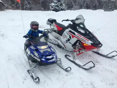 Great working little sled. Stored inside. Cover included. Kids out grew. Looking to trade for Honda...
