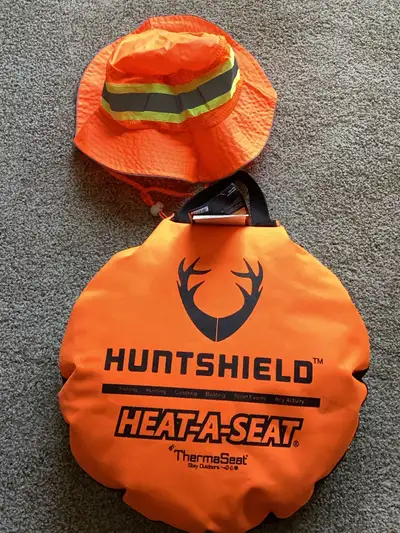 Just never used and NO tax.The Huntshield Heat-A-Seat keeps you warm and dry, no matter how long you...