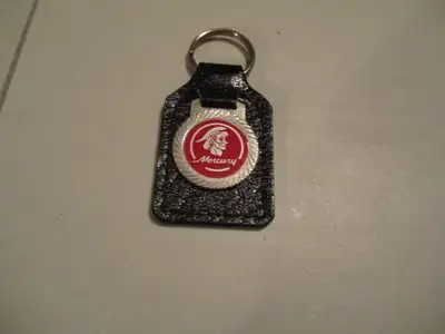 A vintage MERCURY KEYCHAIN & in very good condition. Appx. 3" to top of keyring, clean & proper. Met...