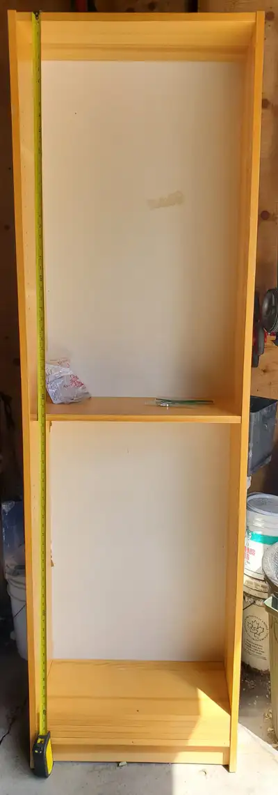 Billy bookcase in natural pine colour. 23 3/4 inch wide and 80 inches tall. Has 4 moveable shelves....