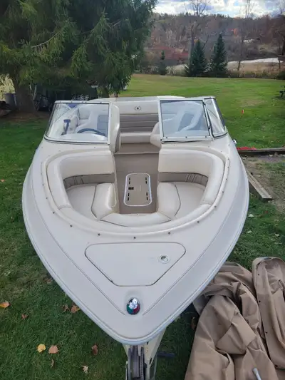 Mint condition comes with trailer. 4 tops, new battery and spare prop