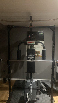 York 3000 gym + Olympic bars and rubber coated plate set.