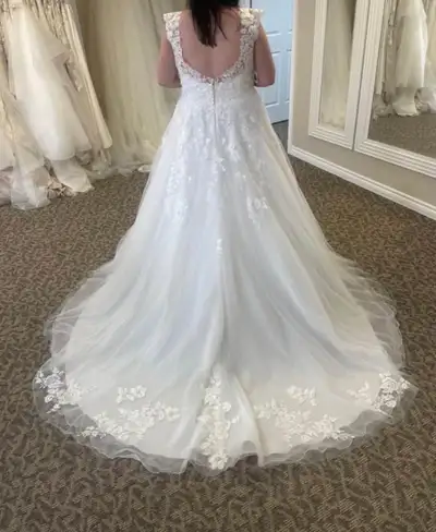 Brand new, never altered wedding gown, View more