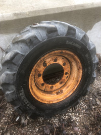Backhoe rim and tire  