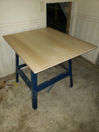 Metal frame table with wooden plank 30” x 37”.