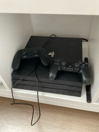 PS4 pro 1tb with 2 controllers and free games 