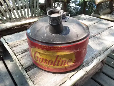 Antique gas can, complete with filler nozzle.