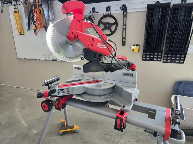 New Condition Milwaukee 12" compound dual beve sliding miter saw in Power Tools in Calgary - Image 4