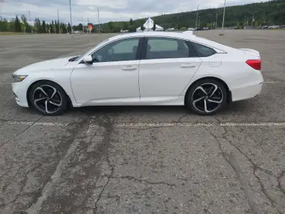 Pearl paint. Sunroof. 4 studded winters with rims and summers with rims. Lady driven. Like new condi...