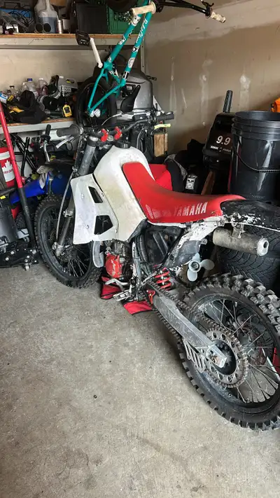 Looking to sell or trade my 1990 Yamaha yz250 2stroke Bike runs and drives needs some work to look g...