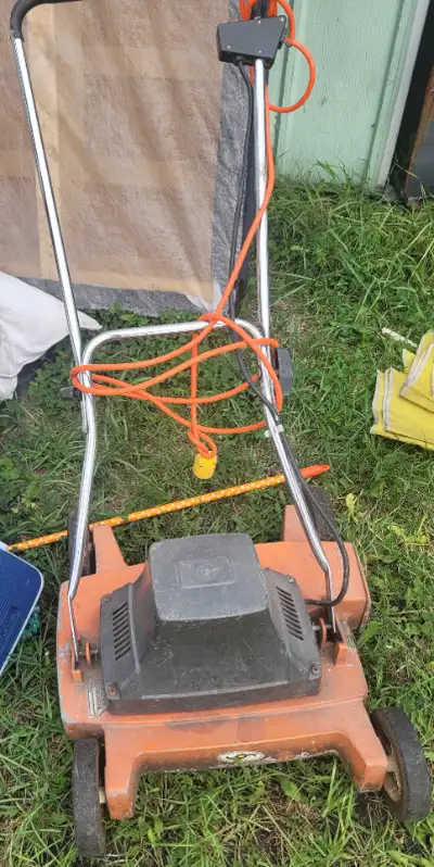 Old vintage orange lawnmower. Lawn maintenance. PLEASE read the ad carefully My name - My name is Ma...