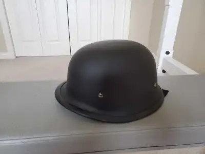 This is a classic German-style motorcycle helmet, providing a sleek and minimalist look with DOT cer...