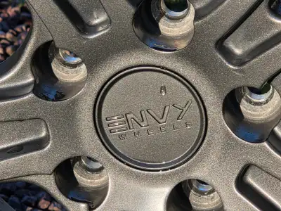 16 Inch Titanium Grey Alloy Rims and studded Winter Tires in good condition. 215/65-16. At least one...