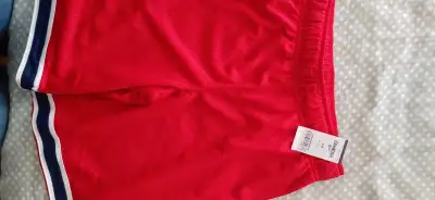 Selling two brand new pairs of OshKosh basketball shorts in red, size 10. Tags still attached. Askin...
