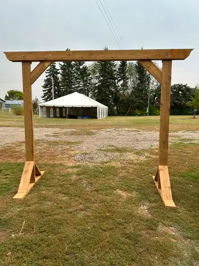 Treated wood wedding arch 2”x6” construction Inside arch is 7’ high and 7’ wide Comes apart into 3 p...