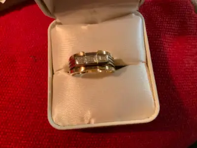 Vintage men’s 10k-14k yellow and white gold cocktail/pinky ring with three diamonds in the centre of...