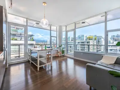 Stunning and sweeping panoramic view of the waterfront, city skyline, and mountains from this 656 sq...