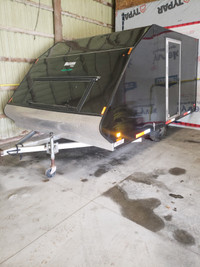 Indoor snowmobile trailer storage