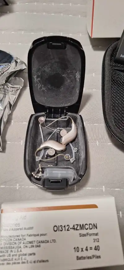 Rarely used hearing aids. Lots of batteries. Bluetooth capable.