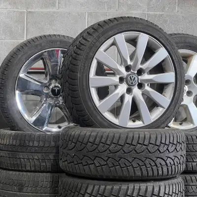 Set of four 225/45/17 winter tires mounted on OEM VW/Audi aluminum rims 5x112 +45. Tires have about...