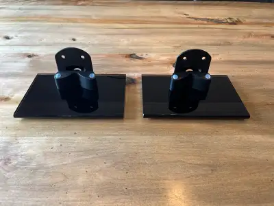 Speaker stands by Klipsch. Work for many small speakers by simply adding screws at the back