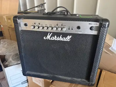 The Marshall MG30CFX is a 30-watt, 1x10" solid-state combo amplifier featuring a modern carbon-fiber...