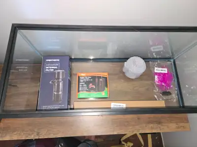 Im selling my aquarium its never been used. Its a 20 gallon long and comes with light, heater and pu...