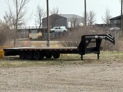2003 PJ triple axle 30 ft flat deck trailer with beaver tail and spring loaded fold up ramps. Also h...