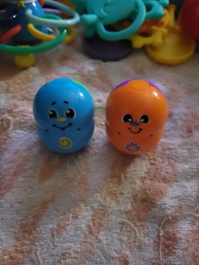 Fisher-Price Topzy Tumblers, which are weighted, roly-poly baby 