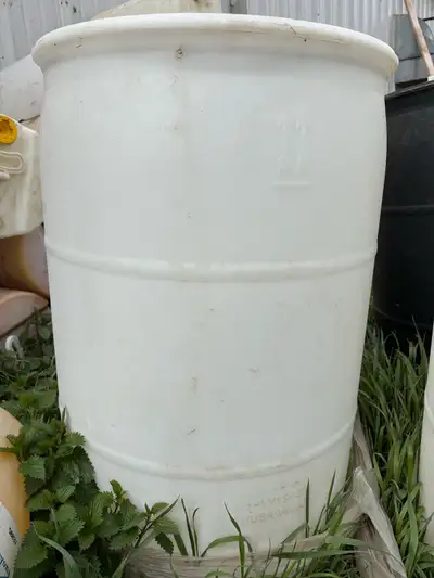 Empty plastic 55 gallon barrels Also have smaller ones