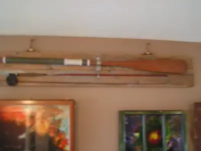 Conoe paddle mounted on rustic boards, View more