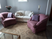 White love seat and 2 dusty rose coloured chairs