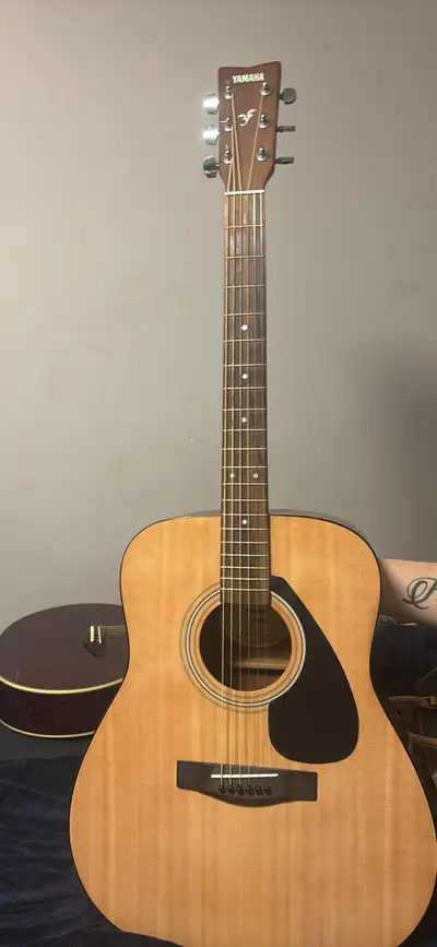 Yamaha F310P acoustic guitar. Made in Indonesia. Good condition. Includes guitar and cloth case
