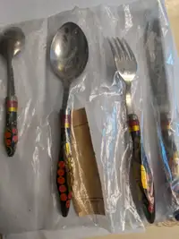 Cutlery with decorative handles