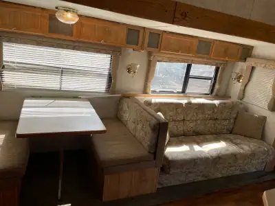 This 36 foot very low kms toy hauler with 12 foot slide out is ready for adventure, featuring a spac...