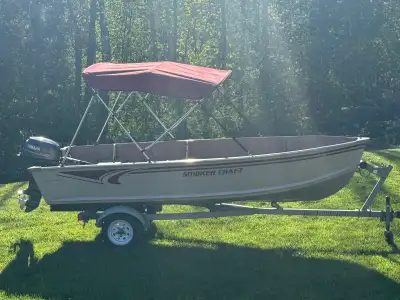 2006 Deep hull 14’ Smokercraft with a 4 stroke Yamaha 15 hp with Electric start . Comes with Galvani...