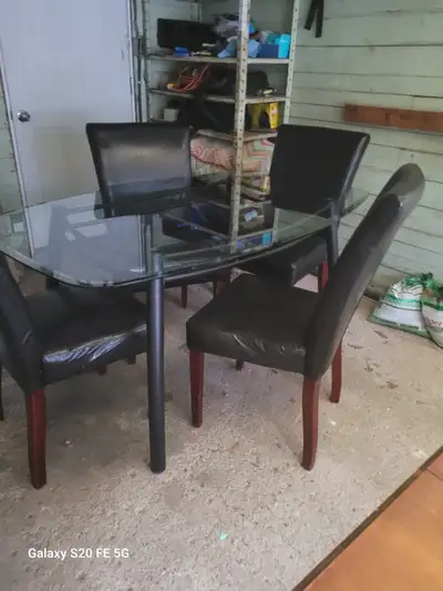 An oval glass dinning table for sale ., View more