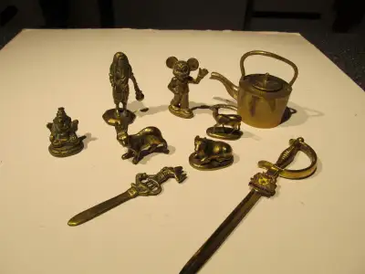 Collection of miniature antique brass pieces., View more