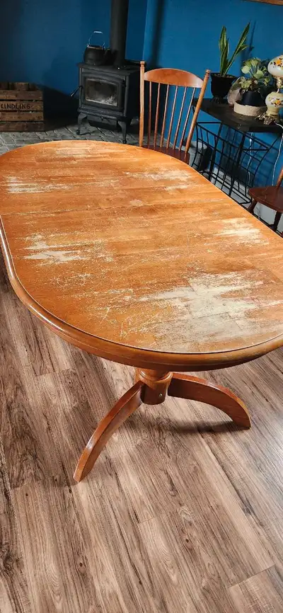 Solid wood dining room table for refinishing project. Expands with 2 leaf sections that fold underne...
